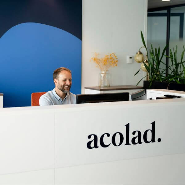 friendly Acolad employee at front desk